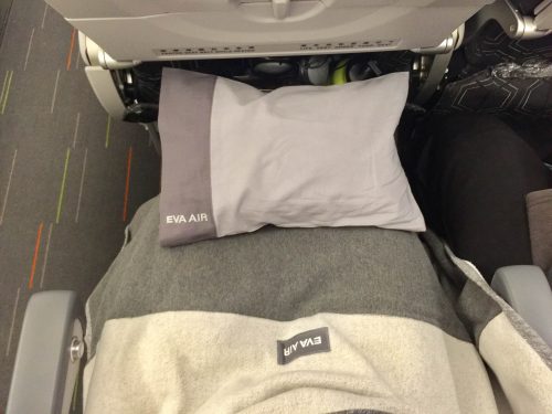 Blanket and pillow provided by Eva Airline 